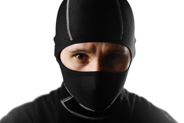 Naklejka premium The man in the black Balaclava. Close up. Isolated on white background