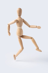 jump wooden mannequin isolated on white background