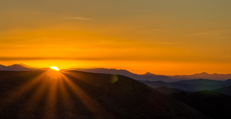 beautiful sunrise over mountain layers over death valley national park