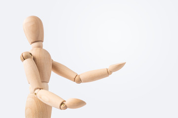 wooden mannequin with welcome gesture