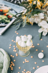 Coffee with mint on a wooden table. Food styling and desserts with flowers.