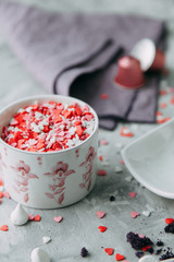 Coffee with mint on a wooden table. Food styling and desserts with flowers.