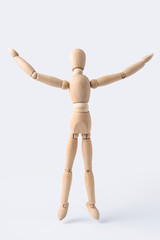 wooden mannequin with open arm gesture