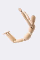 free falling wooden mannequin isolated on white