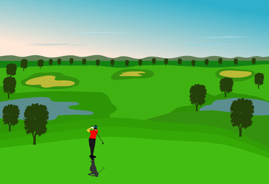Golfers are golfing in the field with mountains as background.