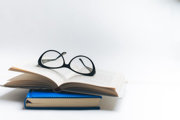 Notebook with glasses and pen, Book with glasses, Blue notebook with glasses, Book with cup of tea