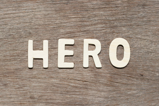 Alphabet letter in word hero on wood background