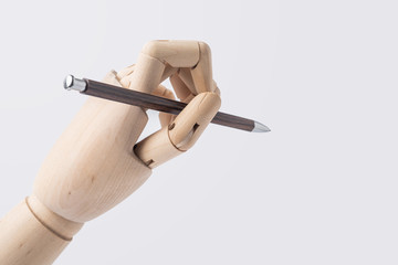 wooden hand hold pen isolated on white background