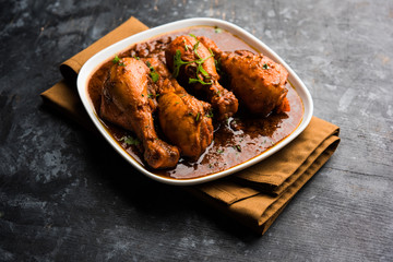 Chicken leg / drumstick curry or Murg Tangri/tangdi masala. Served in a bowl over moody background....