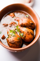 Chicken leg / drumstick curry or Murg Tangri/tangdi masala. Served in a bowl over moody background. Selective focus