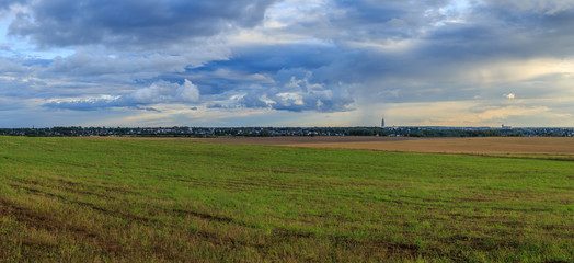 The provincial Russian city on the horizon with the silhouette of the bell tower