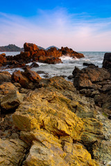 Fototapeta na wymiar Rock at the beach sunset scene.