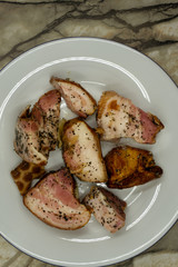 Pieces of fried bacon rashes salt saturated .