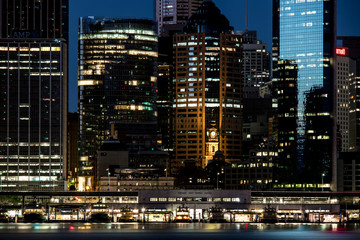 Close-up of Sydney downtown and circular Quay ferry wharves before dawn