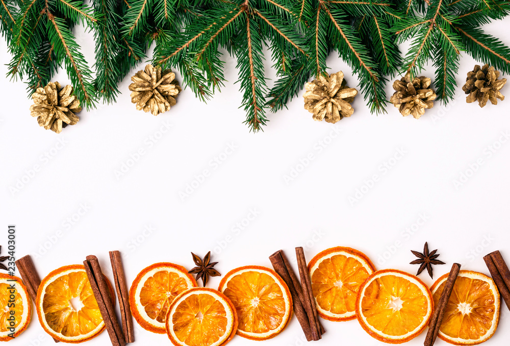 Wall mural christmas nature border of fir branches and dry oranges slices