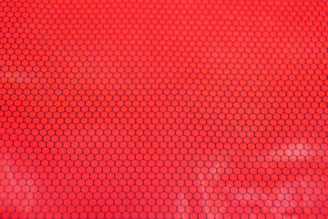Background with the texture of a red fabric .