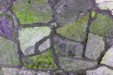 Retaining Wall Detail. Closeup of dry stone wall built with natural flagstones and wallstones of irregular shapes and sizes .
