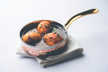 Fried egg curry or anda masala served in a bowl. selective focus