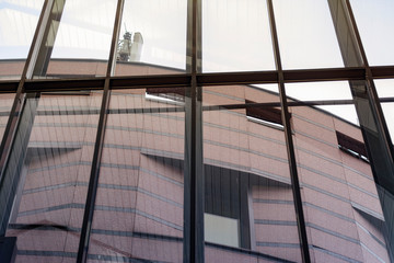 View from the large glass windows to the building with cellular repeaters on the roof