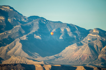Las vegas city surrounded by red rock mountains and valley of fire