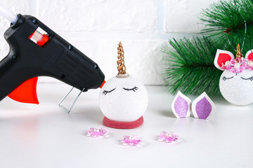 Diy, the unicorn. How to make a unicorn from a Christmas ball toy. Step by step guide photo. Christmas tree decorations.
