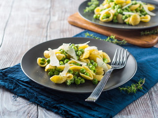 Italian orecchiette pasta with peas, cream and pecorino cheese