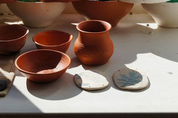 Beautiful bowls and vase in sunlight for drying, Altai,Russia.