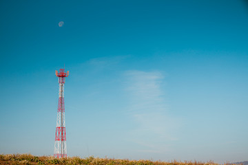 Signal tower against blue sky