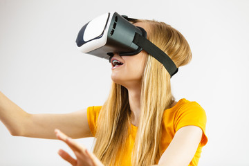Girl wearing virtual reality goggles.