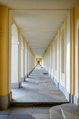 Long corridor with yellow columns
