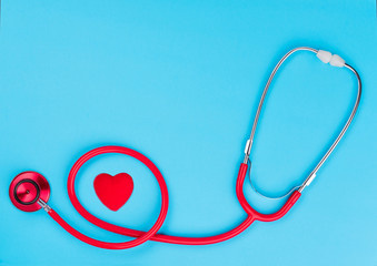 Stethoscope  on blue background with copy space for  text. Top view