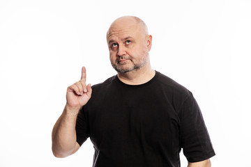 Naklejka premium Adult bald man, forefinger in, attention