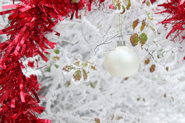 White Christmas ball in a snowy forest