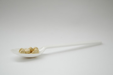 spoon with pills