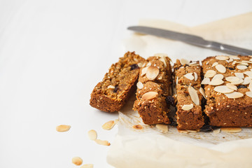 Vegan carrot bread with almonds on a white background, copy space.