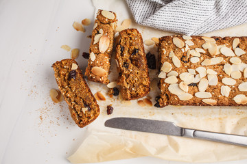 Vegan carrot bread with almonds on a white background.
