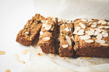 Vegan carrot bread with almonds on a white background, copy space.