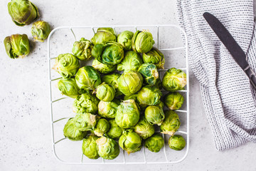 Brussels sprouts raw on a white background.