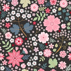 Beautiful seamless ditsy pattern with pink flowers on black background. Fashion design. Vector illustration.