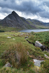 Fototapeta premium Stunning landscape image of countryside around Llyn Ogwen in Snowdonia during early Autumn