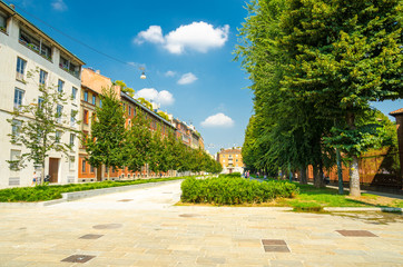 Piazza Sant'Ambrogio square alley street green trees, Milan, Italy