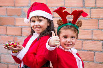 portrait of children dressed as Santa Claus