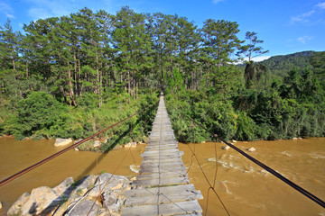Hanging bridge crossing river in Dalat, Vietnam