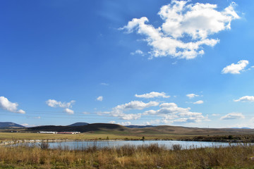 Obraz premium Green forests, river and mountains under blue sky/ landscape nature photography