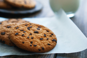sweet homemade biscuits, family recipe, handcrafted pastry. chocolate chip cookies and glass of milk