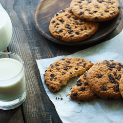 sweet homemade biscuits, handcrafted pastry, family recipe. chocolate chip cookies and glass of milk