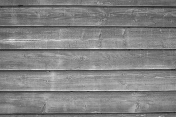 A grey wooden wall with a lot of texture from an hold small house. For any kind of background, wallpapers and desingns. 