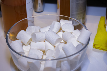 Fototapeta na wymiar Glass bowl with white marshmallow.
