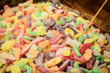 Candied gummy marmalade in the form of animals tomorrow green red tones.
