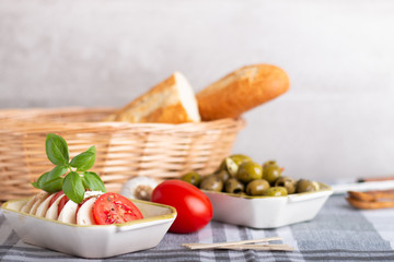 mozzarella with tomatoes and olives